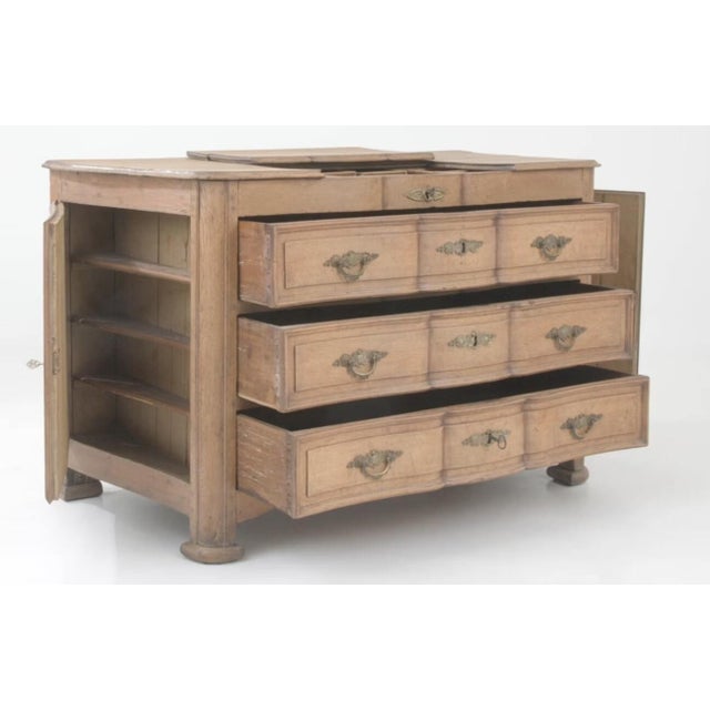 This elegant 19th-century French chest of drawers combines practicality with antique charm. Crafted from high-quality...