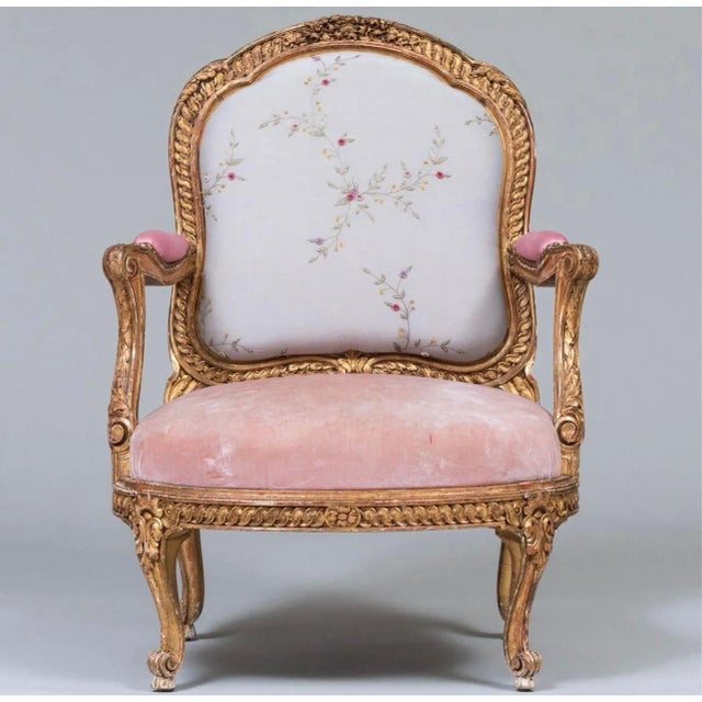 The chair is a copy of a suite of chairs by Nicholas Quinebert Foliot made for the Petit Trianon circa 1765-70. An...