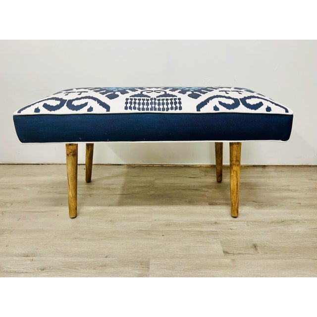 A lovely bench upholstered in bold Quadrille Kazak indoor outdoor fabric. Measures 37” long, 17” wide and 25” tall.