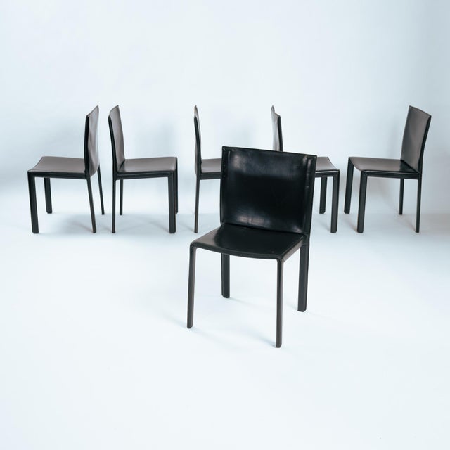 20th c., Italy, Enrico Pellizzoni black saddle-stitched leather over metal frame and seat. These chairs were designed by...