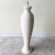 Exceptional vintage 1980s postmodern ceramic floor lamp. Features an off white ribbed body.