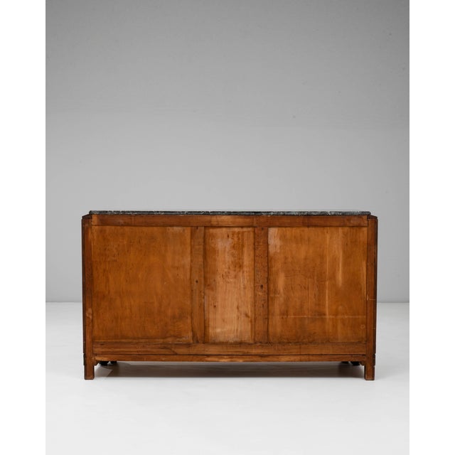 1920s Art Deco Wooden Sideboard with Marble Top. This refined Art Deco sideboard showcases the movements hallmark blend...