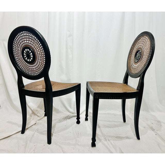 A striking pair of Italian neoclassical-style chairs, crafted in richly toned walnut and featuring beautifully detailed...