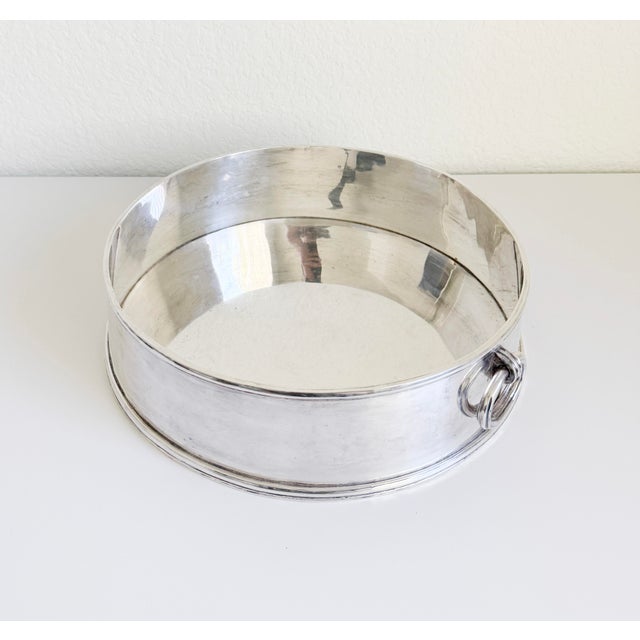 A dramatic jardinière planter or centerpiece bowl produced by Ralph Lauren, circa late 20th century. The silver-plate...