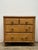 There is a certain charm to the smaller pieces of furniture that have worked hard throughout their lives. Never grand or...