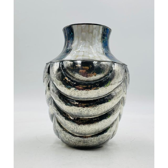 This stunning silver-plated vase designed and manufactured by Los Castillo in the early 1970's. The piece was handcrafted...