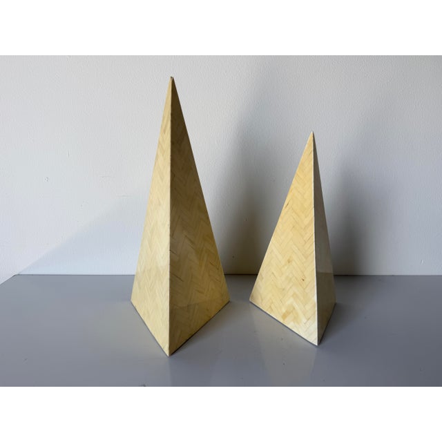 Striking pair of 1980s Postmodern decorative pyramid obelisks featuring tessellated bone surfaces arranged in a subtle...
