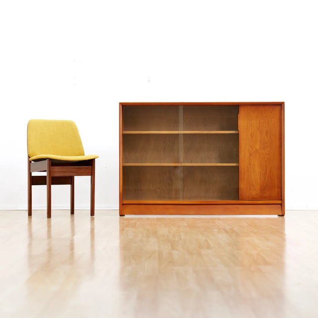 This vintage mid-century china cabinet by Herbert. E Gibbs is a wonderful design and excellent storage piece. Made from...