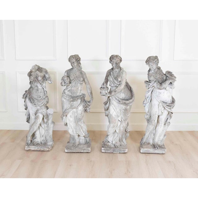 A rare and beautifully unified set of four Italian Neoclassical garden sculptures from the 1930s, conceived as an...