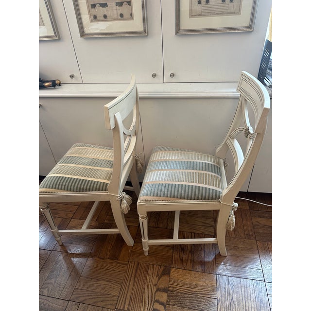 Hollywood Regency Two Bellman Chairs, White Lacquered With Gold Cilding, New Upholstered Seats and Chair Ties For Sale - Image 4 of 15