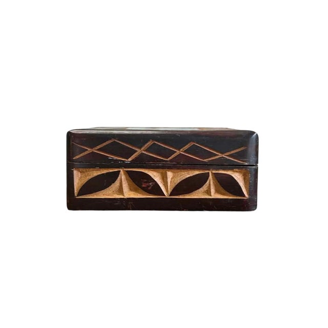 Rich in character and handcrafted appeal, this vintage wooden trinket box showcases a striking combination of carved and...