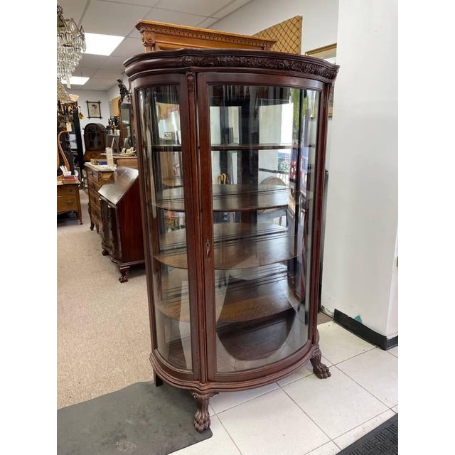 Up for sale is a beutiful antique curio cabinet. It is made of solid authentic tiger oak, with its wood grain showing...