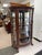 Up for sale is a beutiful antique curio cabinet. It is made of solid authentic tiger oak, with its wood grain showing...