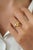 This clover cocktail ring showcases a 2.04 carat lemon topaz set in 14K Yellow gold. The gemstone measuring 9.5 x 9.5 mm,...