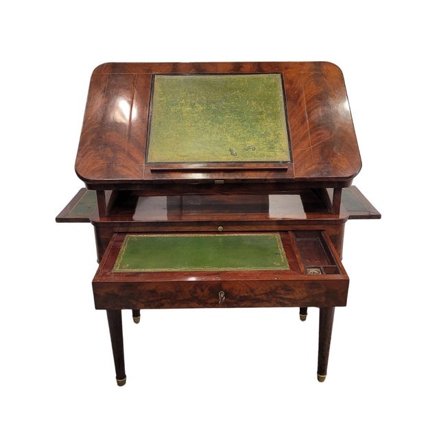 One of a kind French Louis XVI architect's table with a rectangular profile, made of mahogany and mahogany veneer, known...