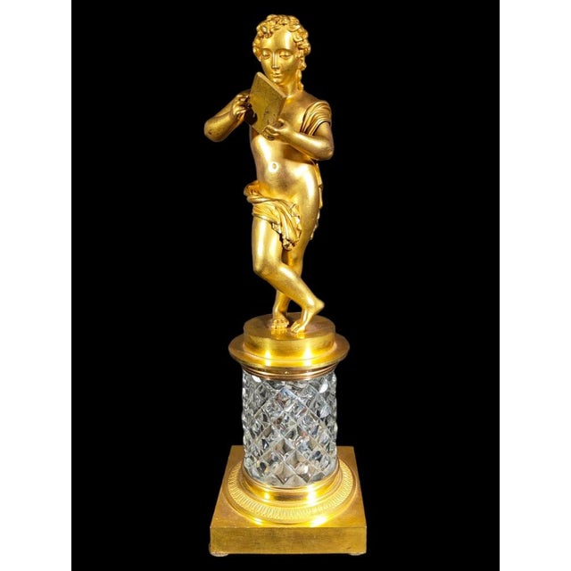 Baccarat crystal and gilt bronze figurine Figure in french gold bronze with baccarat sculpted glass base. The quality of...