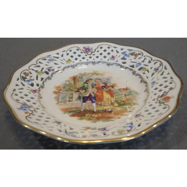 Up for sale is a Late 1940’s Post-WWII Era Cico China Victorian Couple/Floral Motifs Reticulated Edge Plate Made in...