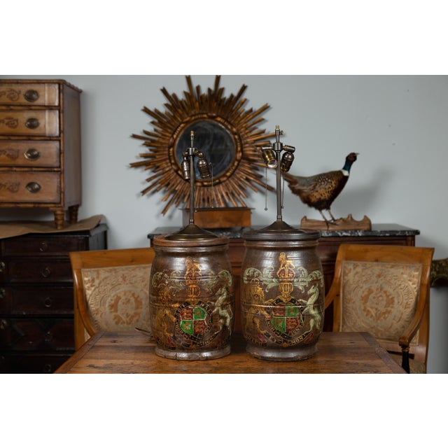 A pair of English wooden barrels from the late 19th century with the United Kingdom’s royal coat of arms, made into two-...