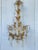 Italian Gilt Tole Chandelier. Highly glamorous this six light chandelier would be perfect in a powder room or entryway....