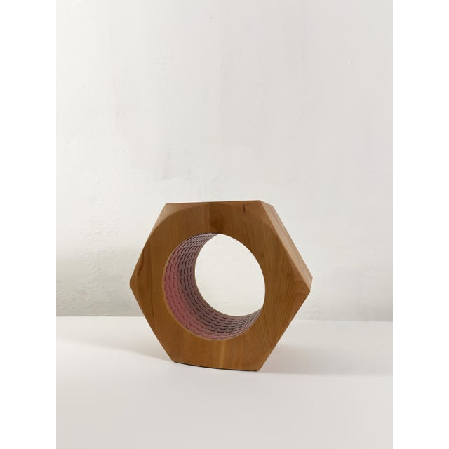 Shaped with the precision of an oversized engineering nut, this sculptural stool transforms utility into playful design. A...