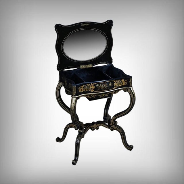 This coffee table captivates with the elegance of its intricately designed top, featuring rounded corners and embellished...