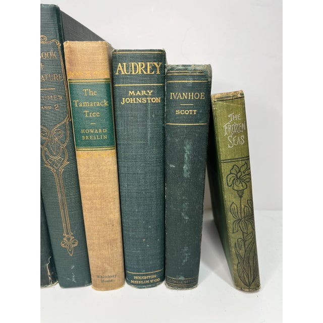 Set of 8 vintage and antique books in shades of green and tan. Varying subject matters and sizes. Condition varies and...