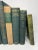 Set of 8 vintage and antique books in shades of green and tan. Varying subject matters and sizes. Condition varies and...