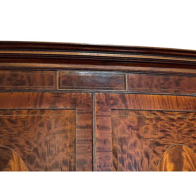 On offer is a beautiful quality, two-door, bow fronted mahogany wardrobe/armoire with the top having a dentil cornice over...