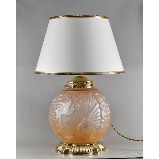 Muller frères A very rare 1925-1935 French art deco lamp. The base made in solid brass and salmon coloured frosted pressed...