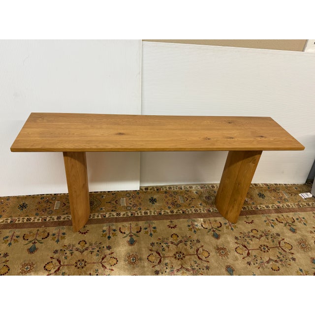 Design Plus Gallery presents the Pickford Console Table from Four Hands. A shape-driven console table made from thick-cut...