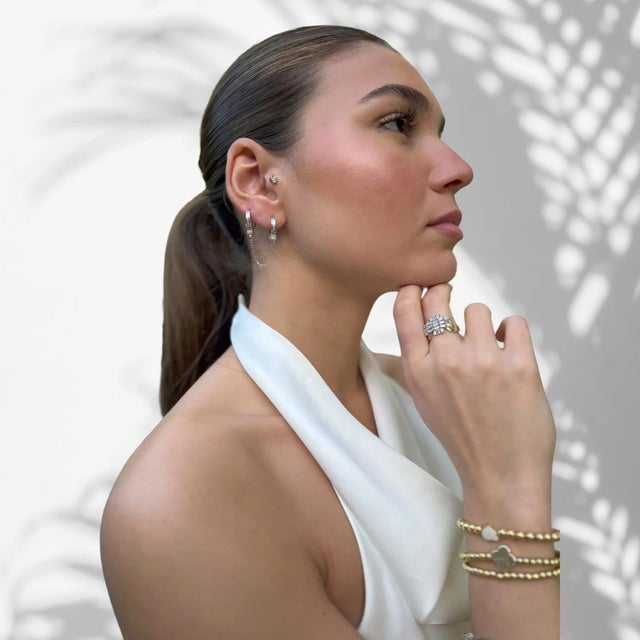 Embrace your individuality and express your inner confidence with Sterling Silver & Diamond Handcuff Design Earring, a...