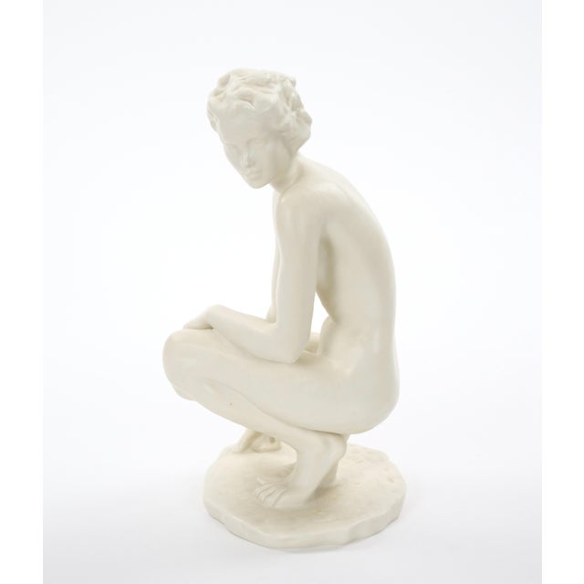This elegant early 20th-century Rosenthal porcelain figure, titled Die Hockende (“The Crouching Woman”), was designed by...