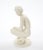This elegant early 20th-century Rosenthal porcelain figure, titled Die Hockende (“The Crouching Woman”), was designed by...