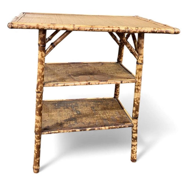 This antique bamboo side table is a stunning example of Victorian Anglo-Japanese furniture, crafted circa 1880–1900 to...