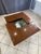Beautiful coffee table/bar with a sliding elm burl top that opens thanks to an ingenious mechanism, revealing a lovely bar...