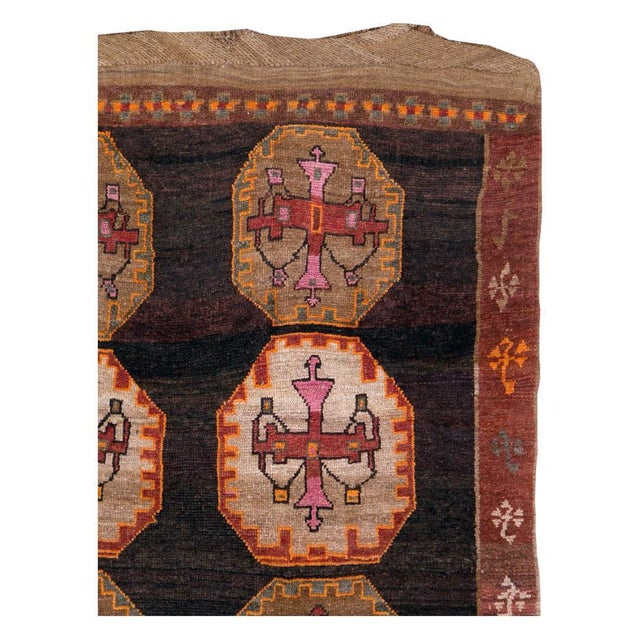 A vintage Turkish Anatolian room size carpet with a tribal design handmade during the mid-20th century. Measures: 7' 9" x...