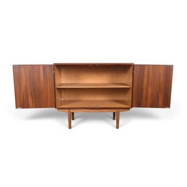 Origin: Denmark Designer: Børge Mogensen Manufacturer: Søborg Era: 1960s Materials: Teak, Oak Measurements: 39.5″ wide x...