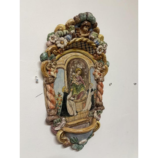 Large holy water stoup depicting the Madonna of Pompeii, entirely handmade with three little cherub angels and two doves,...