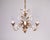 Introducing a luxurious collection of gilt chandeliers with white enamel lily flowers. Perfect for hallways, dining rooms,...