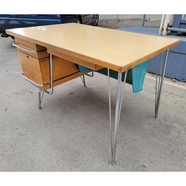 Mid-Century Modern "Trimline" desk by Kem Weber for Heywood Wakefiel. Circa. 1950's. Made of birch and polished chrome...