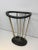 Attributed to Jacques Adnet. Ebonized wood and brass umbrella stand. French, circa 1950.