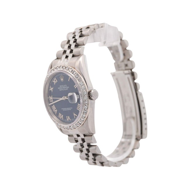 1999 Year Rolex Oyster Perpetual Datejust 36mm automatic watch in stainless steel featuring a navy blue dial with silver...