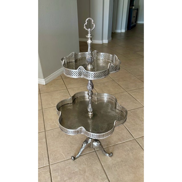 Unique French silverplate two-tier etagere food or beverage display table. Nice detailing throughout including tripod...