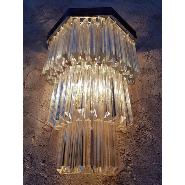 - Wall lamp produced circa 1960 by Venini - Metal structure - Inserts on the upper edging - 80 trihedral glasses (28 cm...