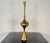 Single Hollywood Regency Style Brass Table / Desk Lamp A lovely brass reverse funnel base supporting a boubous form center...