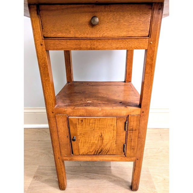 Offered is a remarkable Early 19th Century primitive pine commode or washstand table, dating circa 1810–1850. Brimming...