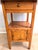 Offered is a remarkable Early 19th Century primitive pine commode or washstand table, dating circa 1810–1850. Brimming...