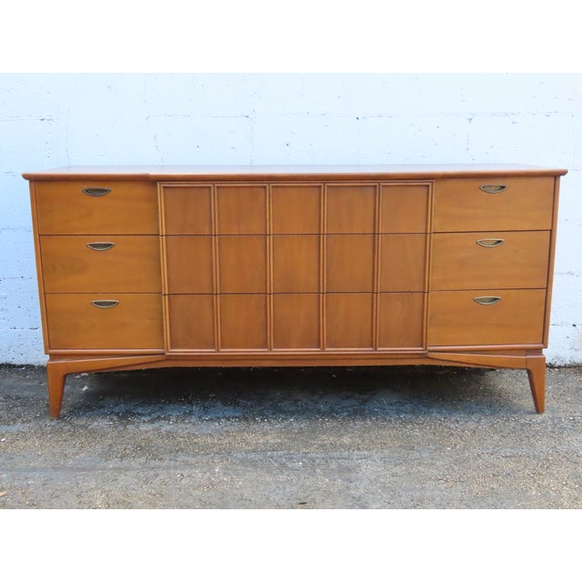 This magnificent Dresser is made of wood, walnut, and veneer. It was made by Kent Coffey Parkway, and it is stamped. This...