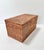 Vintage handwoven rattan storage box featuring a dense basket weave, fitted lid and traditional woven toggle closure. The...