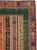This Mid-20th Century Turkish Anatolian accent rug presents a richly layered composition organized around a central panel...